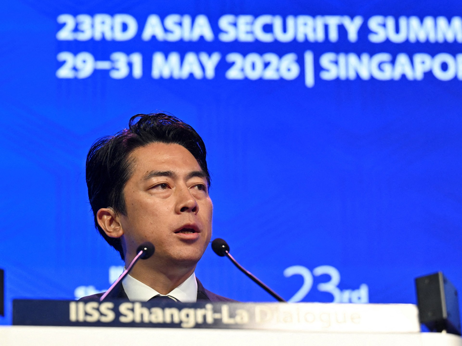 Japan rejects ‘new militarism’, says China is rapidly arming 